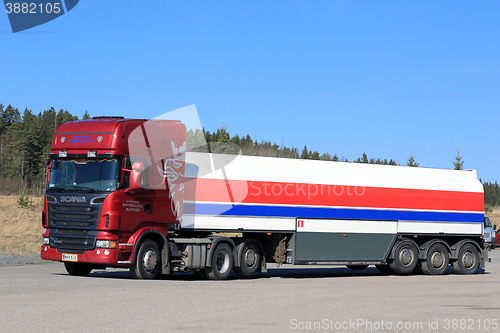 Image of Red Scania R580 Semi Tank Truck and Blue Sky