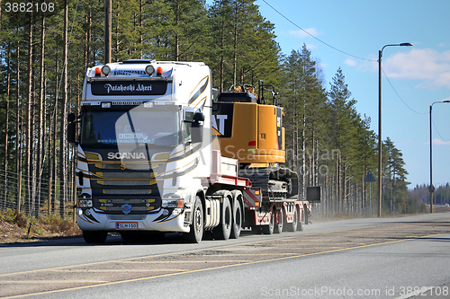 Image of Super Scania Transports Caterpillar Equipment
