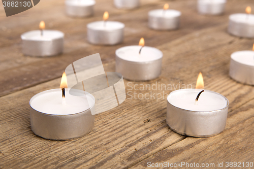 Image of Candles on wooden background