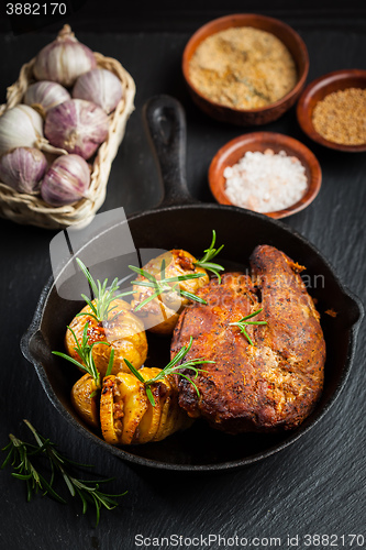 Image of Pulled pork dish with backed rustic potates