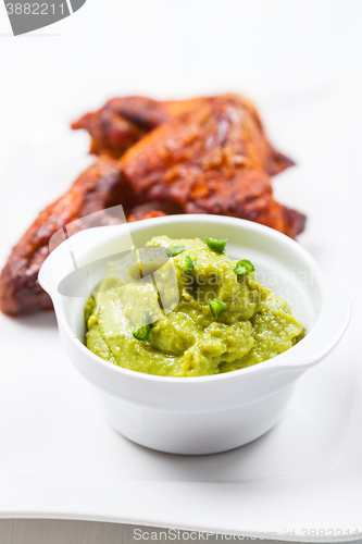 Image of Grilled chicken wings with guacamole