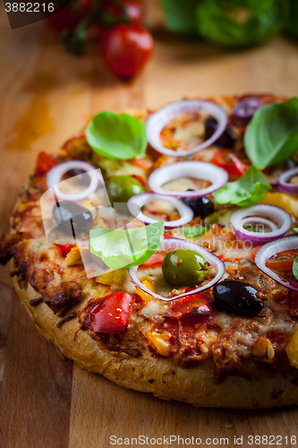 Image of Traditional homemade pizza with tomatoes and olives