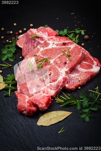 Image of Fresh raw meat on black board