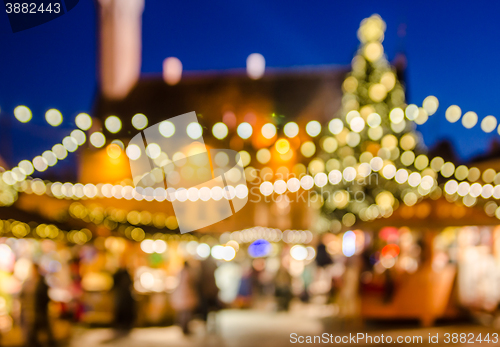 Image of Decorated Christmas market. Abstract blurred lights background