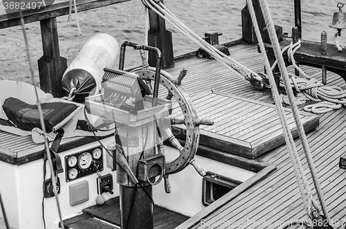 Image of Steering wheel and deck of the old boat