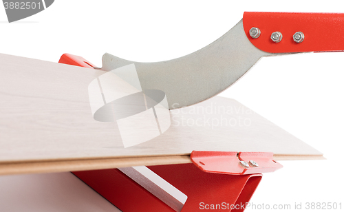 Image of Red tool for cutting laminate