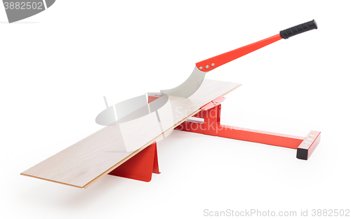 Image of Red tool for cutting laminate