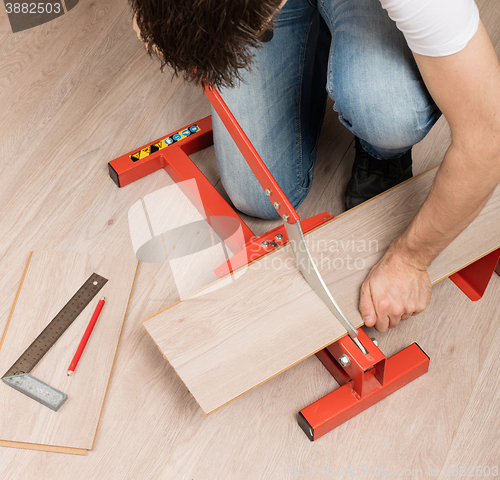 Image of Red tool for cutting laminate