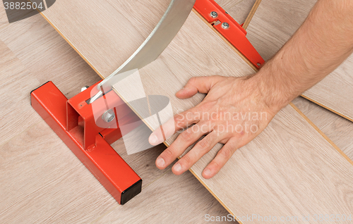 Image of Red tool for cutting laminate