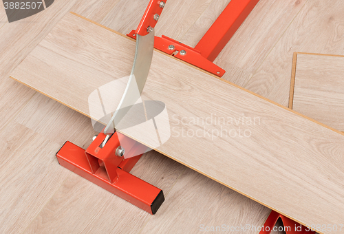 Image of Red tool for cutting laminate