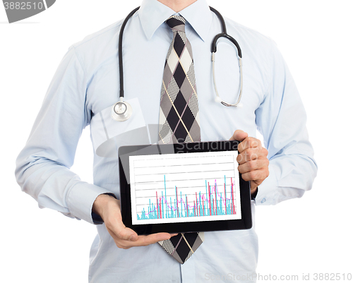 Image of Doctor holding tablet - Graph
