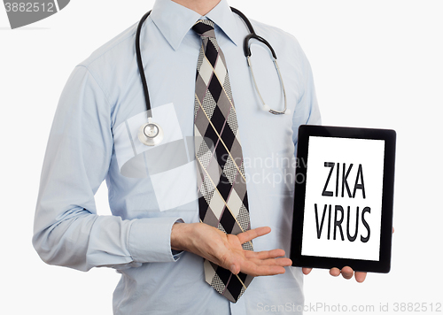 Image of Doctor holding tablet - Zika virus