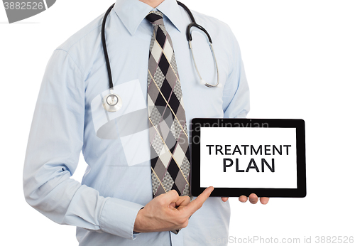 Image of Doctor holding tablet - Treatment plan