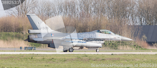 Image of LEEUWARDEN, NETHERLANDS - APRIL 11, 2016: A dutch F-16 on the gr