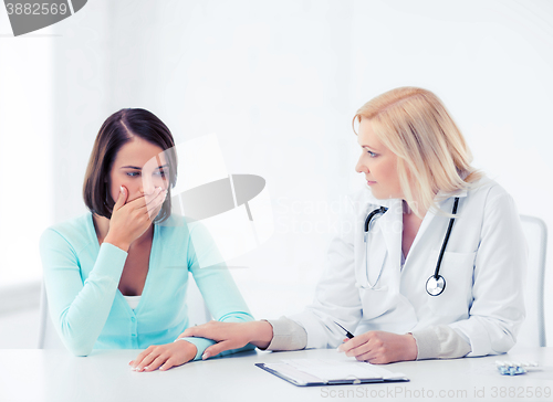 Image of doctor with patient in hospital