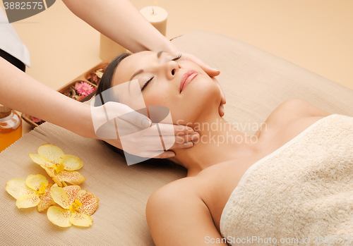 Image of beautiful woman in massage salon