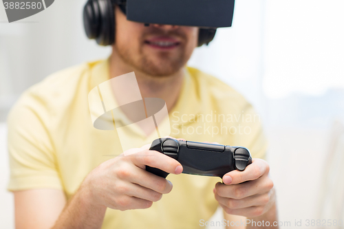 Image of close up of man in virtual reality headset playing