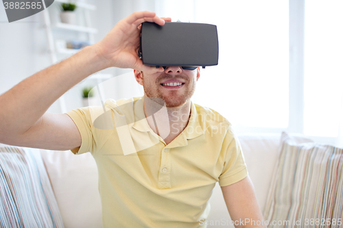 Image of young man in virtual reality headset or 3d glasses