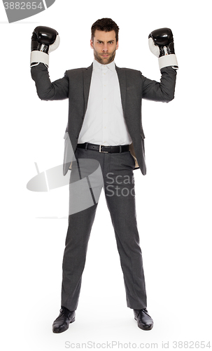 Image of Businessman in boxing gloves 