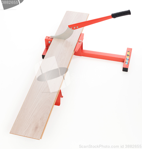 Image of Red tool for cutting laminate