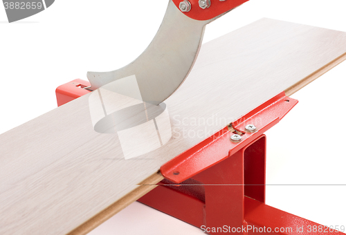 Image of Red tool for cutting laminate