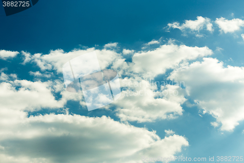 Image of White clouds on evening blue sky