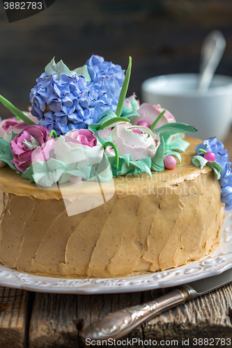 Image of Cake with cream flowers from close up.