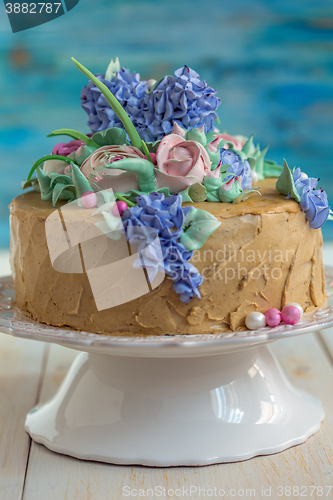 Image of Coffee cake with floral decoration.