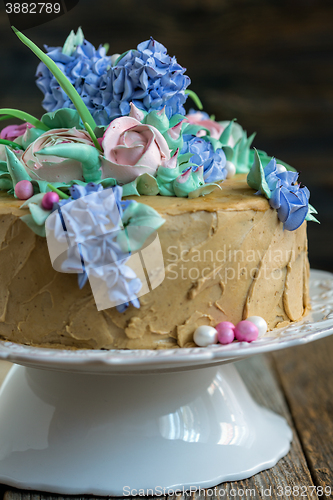 Image of Coffee cake with flowers of cream.