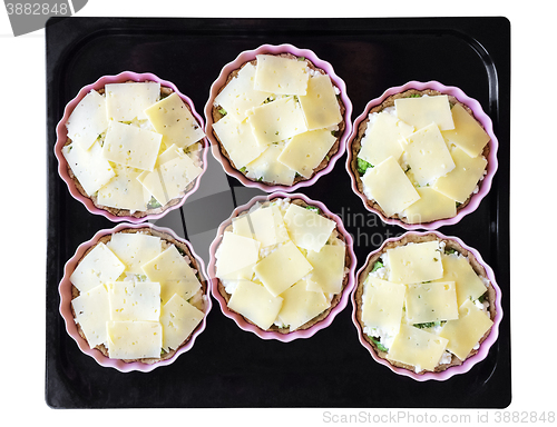 Image of Cheese and broccoli pies on a baking tray