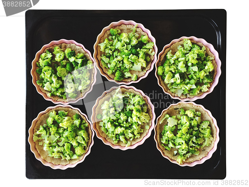 Image of Broccoli pies on a baking tray