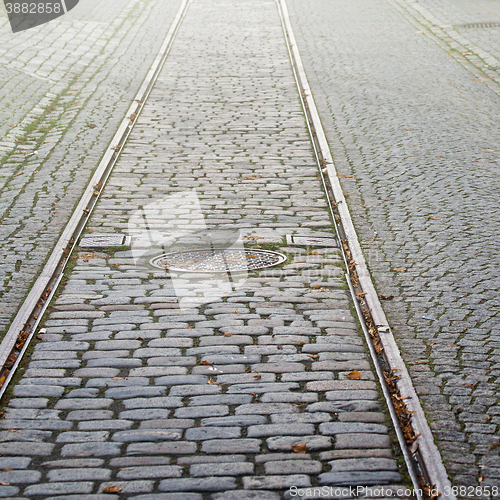 Image of Tram rails and manhole cover