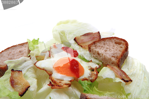 Image of ham and eggs with lettuce and bread