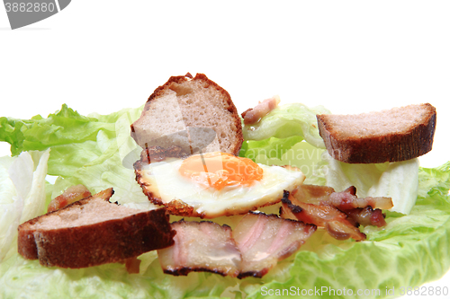 Image of ham and eggs with lettuce and bread