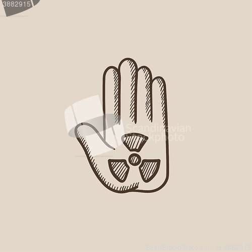 Image of Ionizing radiation sign on a palm sketch icon.