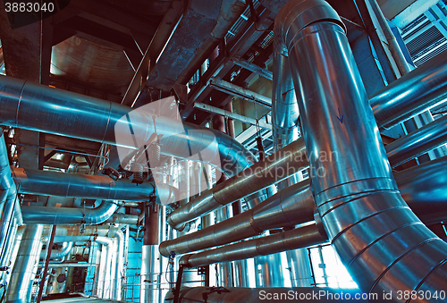 Image of Equipment, cables and piping as found inside of a modern industrial power plant