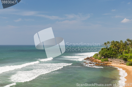 Image of sea or ocean waves and blue sky on Sri Lanka beach