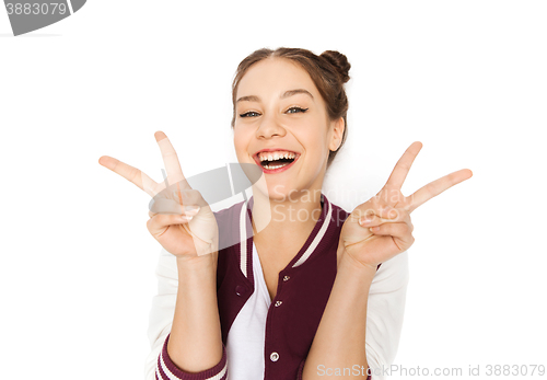 Image of happy smiling teenage girl showing peace sign
