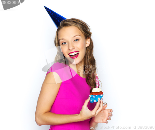 Image of happy woman or teen girl with birthday cupcake