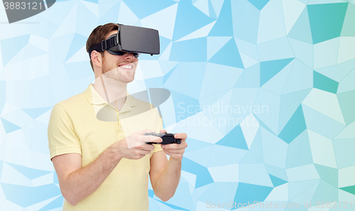 Image of happy man in virtual reality headset with gamepad