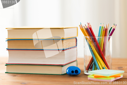 Image of close up of crayons or color pencils and books