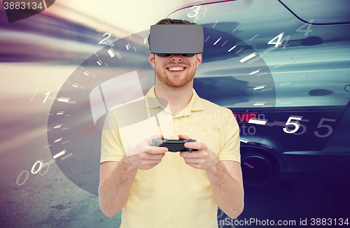Image of man in virtual reality headset and car racing game