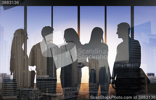 Image of people silhouettes over city background