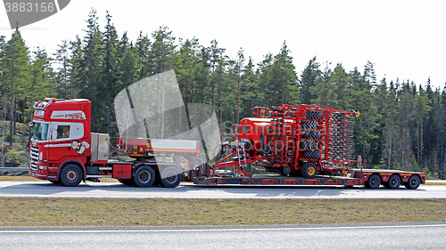 Image of Scania Semi Hauls Agricultural Machinery in High Speed