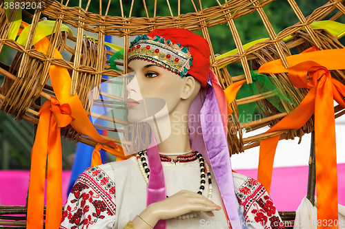 Image of The ancient national dress and a hat on the dummy.