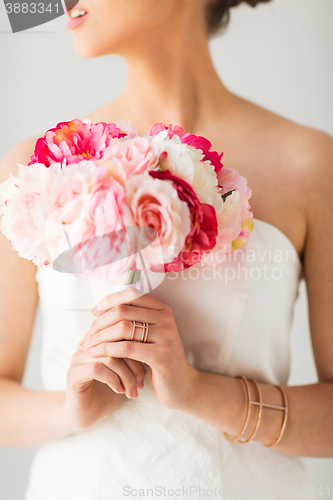 Image of close up of woman or bride with flower bouquet