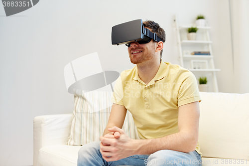 Image of young man in virtual reality headset or 3d glasses