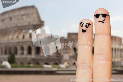 Image of close up of two fingers with smiley faces