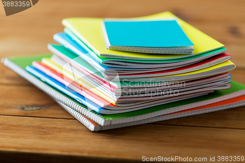 Image of close up of notebooks on wooden table