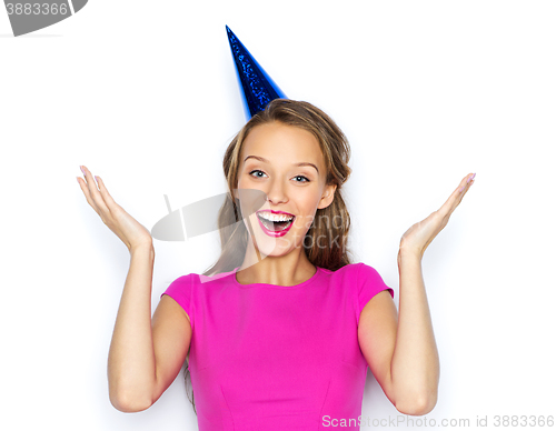 Image of happy young woman or teen girl in party cap